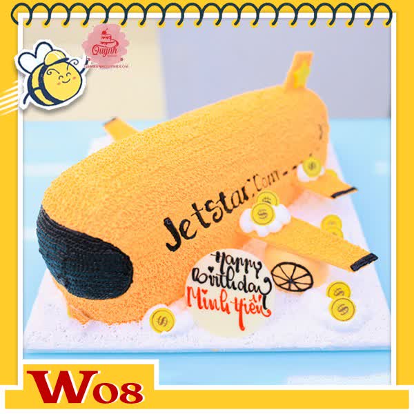 Bánh kem máy bay W08 hãng Jetstar nền cam cửa sổ đen trang trí thêm đồng tiền vàng