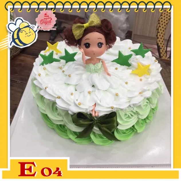 giới thiệu tổng quan Bánh kem búp bê E04 váy trắng trên nền bánh xanh lá nhạt trang trí nhiều ngôi sao lấp lánh