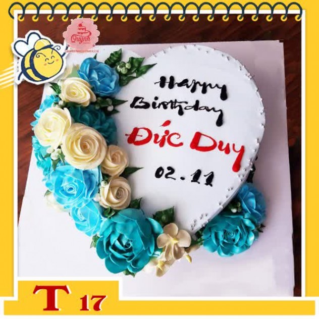 giới thiệu tổng quan Bánh kem trái tim T17 nền trắng kèm hoa xanh vàng ở nửa bên cực ấn tượng dành cho nam